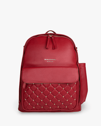 Crimson vegan leather Daphne diaper bag featuring gold studs, quilted front pocket, and coastal-inspired luxury design for style and utility.