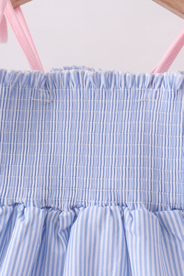 Blue stripe seersucker smocked top with pink straps and gathered ruffle shorts set.