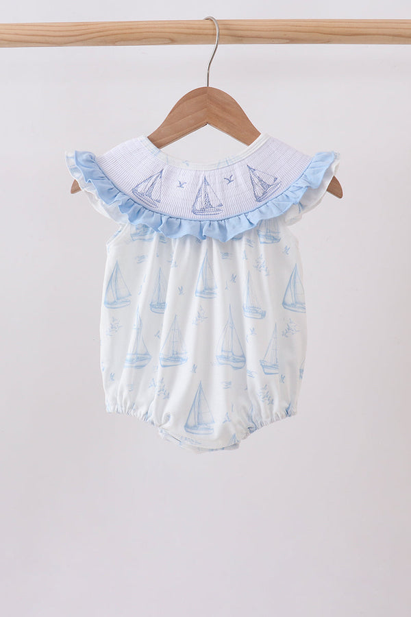 Blue Sailboat Smocked Ruffle Bubble with light blue sailboat print, smocked bodice, and ruffled collar.