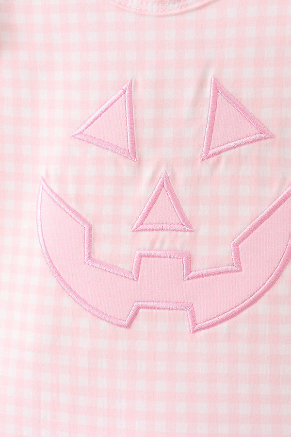 Pink gingham top with a pink jack-o-lantern applique patch, part of the bloomer set.