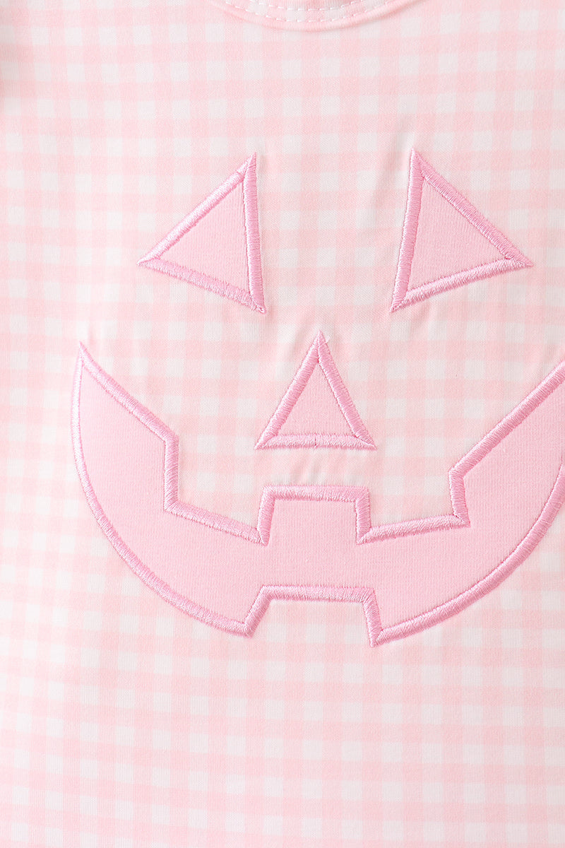 Pink gingham top with a pink jack-o-lantern applique patch, part of the bloomer set.