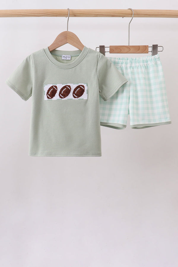 Boys’ sage green tee with three footballs in French knot embroidery paired with mint gingham shorts.