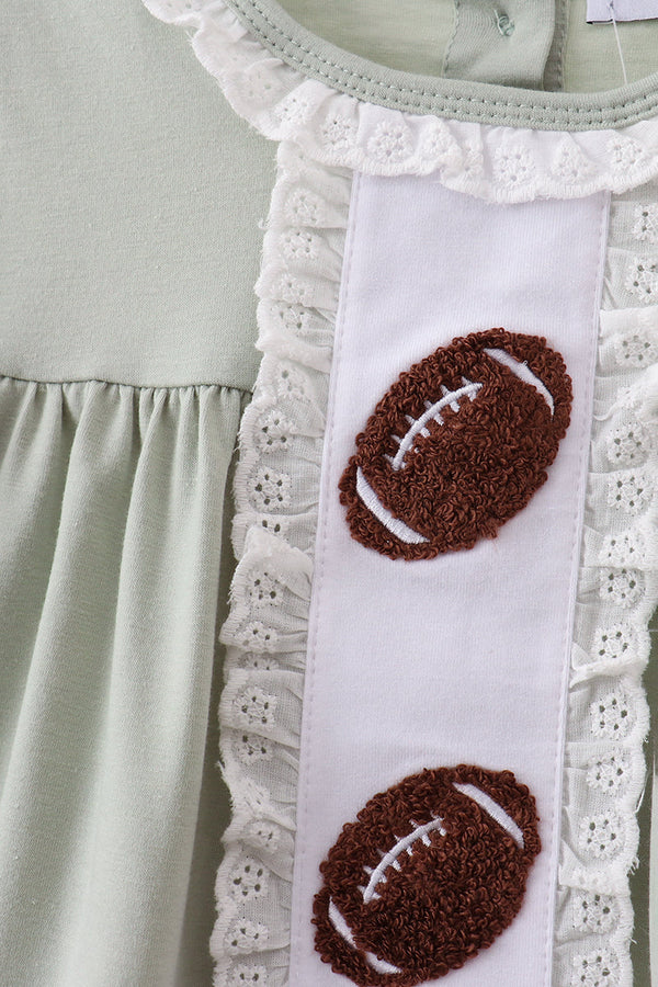 Green gingham shorts set with white lace trim, ruffles, and brown football French-knot embroidery.