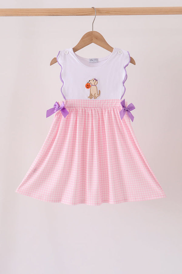 Girl's dress with pink gingham skirt, purple bows, and puppy pumpkin applique on white scalloped top.