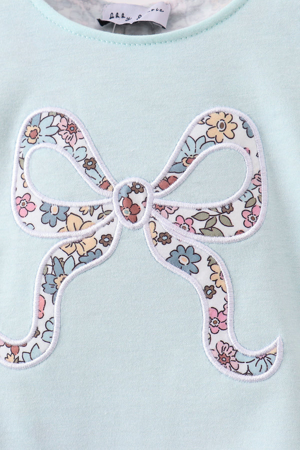 Blue floral bow applique on pale blue bubble garment for kids