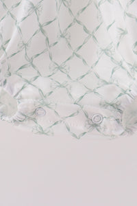 White bubble with sage green bow print, ruffled hem, and snap closure for comfortable fall fit.