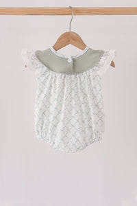 Sage green bubble romper with delicate pumpkin print, ruffled lace sleeves, and soft collar for cute autumn style.