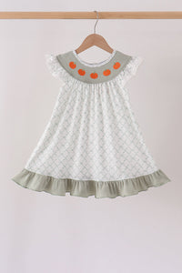 Sage green children's dress with pumpkin embroidery on the collar, ruffled hem, and lattice pattern for autumn.