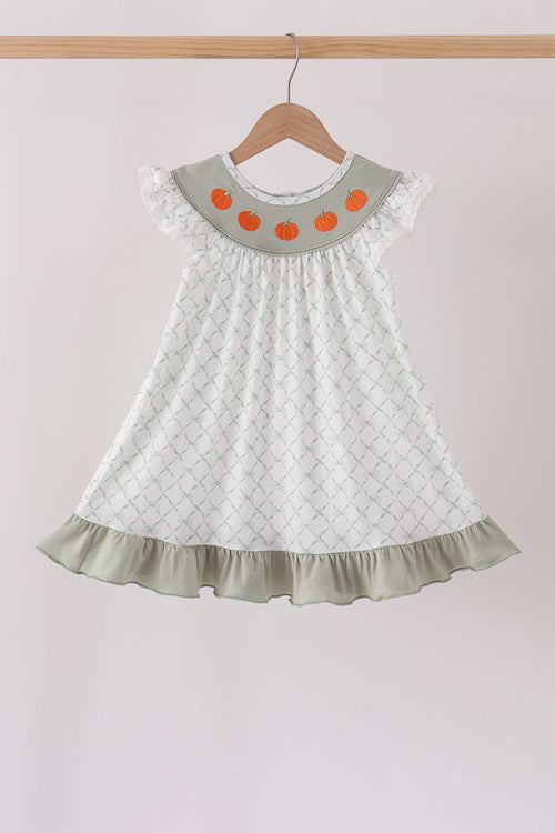 Sage green children's dress with pumpkin embroidery on the collar, ruffled hem, and lattice pattern for autumn.