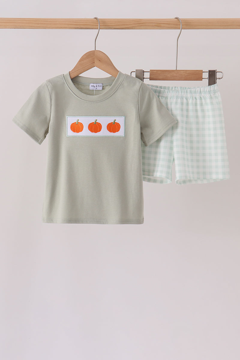Sage green children's shorts set with gingham shorts and t-shirt featuring three orange pumpkin embroidery patches.