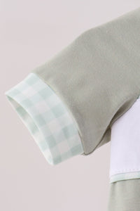 Soft sage green bubble sleeve featuring a delicate light green gingham cuff trim for cozy fall style.