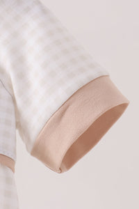 White gingham bubble with soft tan ribbed cuff, offering cozy fall comfort for casual seasonal wear.