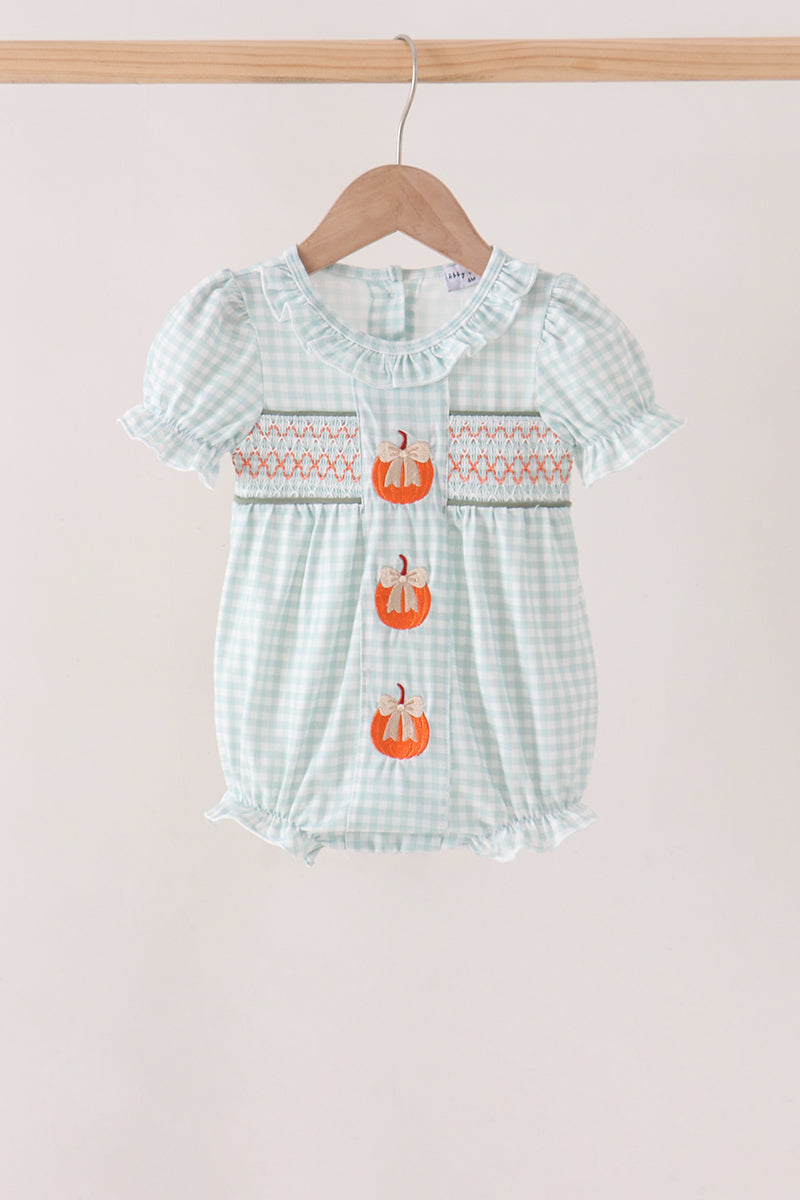 Sage and pumpkin smocked gingham bubble with embroidered pumpkins and ruffled details.
