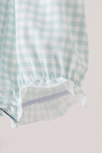 Sage and pumpkin gingham bubble detail showing smocked elastic and lavender snap closure for comfortable everyday wear.