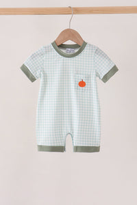 Sage green gingham romper with orange pumpkin embroidery on the chest pocket, featuring green trim and a hanger display.