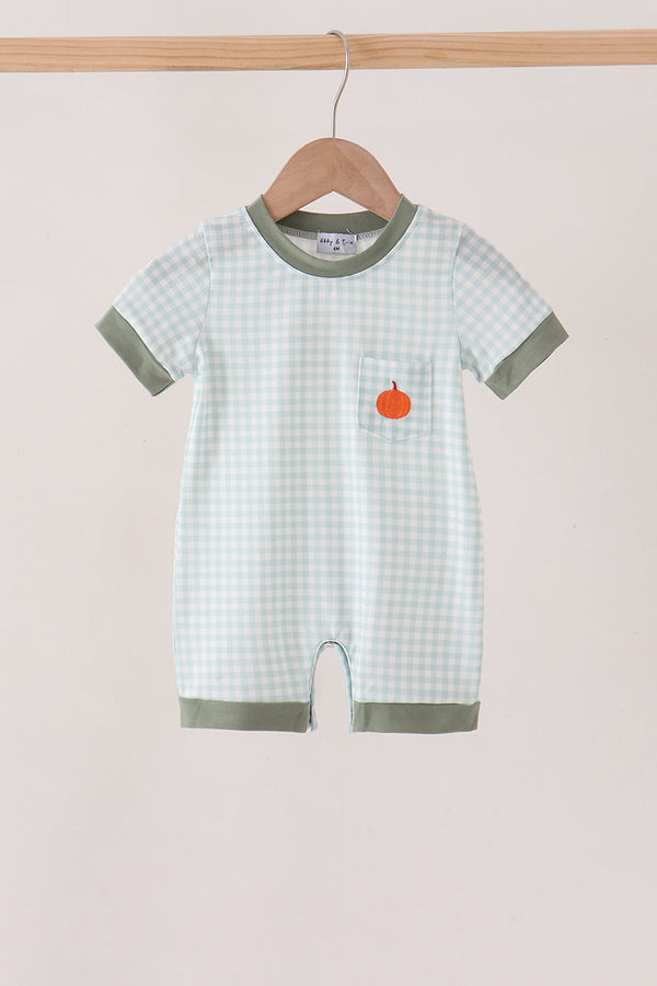 Sage green gingham romper with orange pumpkin embroidery on the chest pocket, featuring green trim and a hanger display.