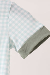 Light blue gingham romper sleeve with sage green ribbed cuff. Soft cotton fabric details for a comfortable baby outfit.