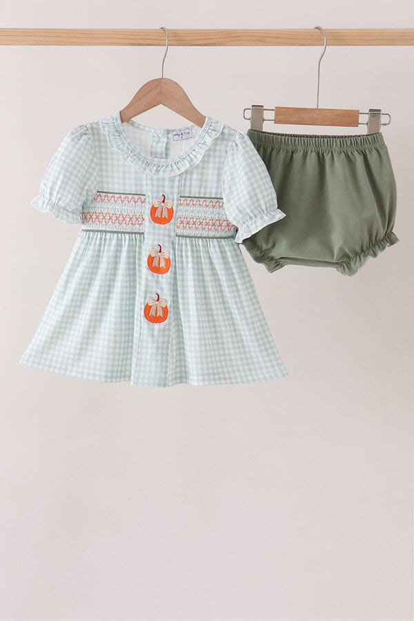 Sage gingham baby dress with embroidered pumpkin details and smocked chest, paired with solid olive green bloomer shorts.