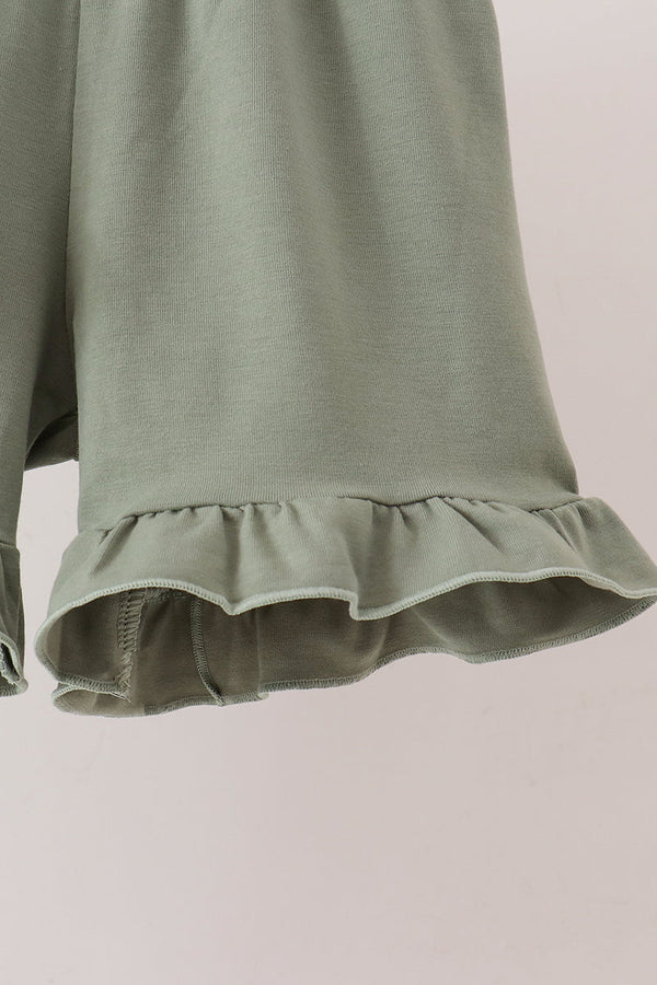 Sage ribbed knit shorts featuring a delicate ruffled hem detail for a comfortable and stylish children's outfit.