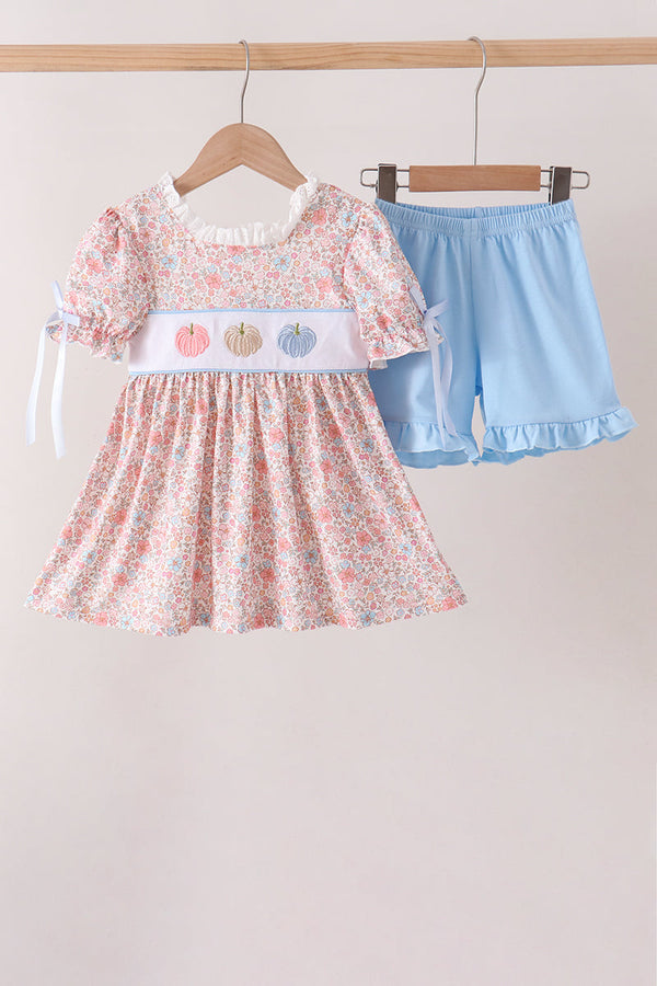 Pink floral dress with embroidered pumpkins paired with light blue ruffled shorts for a cute kids outfit set.