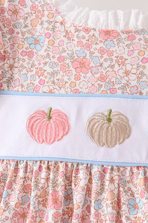 Pink floral fabric with white band featuring embroidered pink and beige pumpkins, bordered by light blue trim for a festive autumn set.