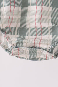 Green plaid bubble shorts with snap closures. Feathers are soft, classic tartan pattern in sage, white, and dusty pink for cozy fall wear.