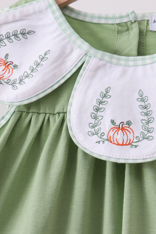 Sage green two-piece shorts set with white embroidered bib collars featuring pumpkins and leafy vines.