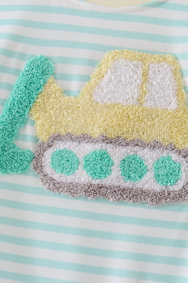 Close-up of a baby garment with mint green and white horizontal stripes, featuring a textured applique of a construction vehicle in yellow, white, gray, and mint green.