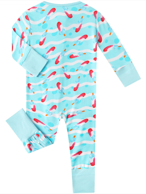 Children's onesie with colorful fish pattern on a light blue background
