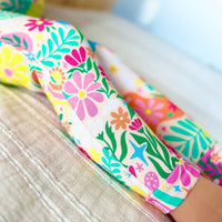 The Second-Skin 2-Piece Short Sleeve Pajama in Rainbow Daisy Babe with hand-drawn floral print.