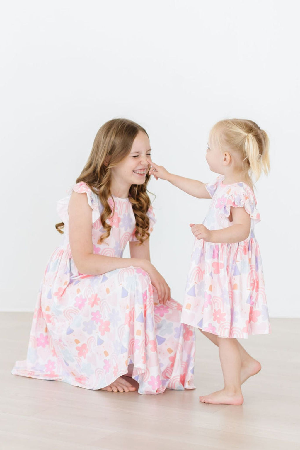 Castles & Rainbows Flutter Sleeve Twirl Dress for Girls by Mila & Rose, showcasing whimsical prints and flutter sleeves ideal for imaginative play.