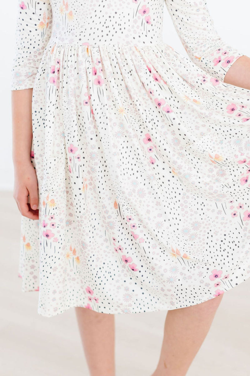 Whimsical Wildflowers 3/4 Sleeve Pocket Twirl Dress featuring a beautiful floral print, ideal for twirling and play. Perfect for young girls.