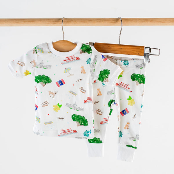Mississippi Kids GOTS-certified organic cotton sleepwear: newborn gown with white trim and matching pants in 1x1 rib.