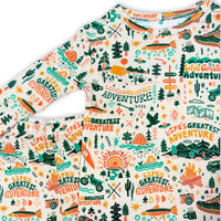 The Second-Skin 2-Piece Long Sleeve Pajama set with nature print of trees, cacti, suns, and Life's Greatest Adventure.