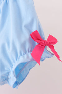 Light blue bloomers featuring a gathered ruffle leg and a bright pink ribbon bow detail for a sweet vintage Inspired look.