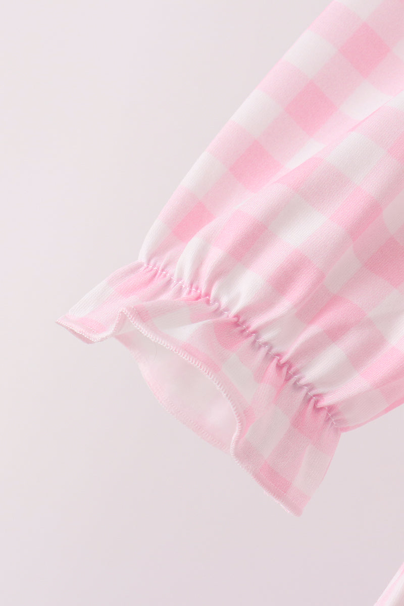 Pink gingham bloomer leg with delicate ruffled elastic cuff. Sweet vintage-inspired fabric detail for festive children's wear.