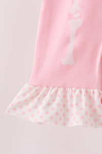 Pink skeleton print ruffle romper