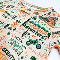 Close-up of The Second-Skin 2-Piece Long Sleeve Pajama fabric in Wanderlust print, featuring hand-drawn travel icons.
