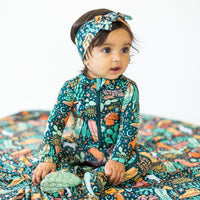 The SoftKnot Bow in Wild West on a baby wearing a CozyMa bamboo head-wrap bow.