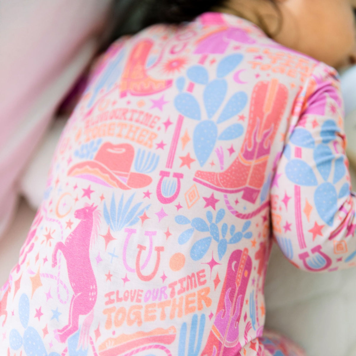 Close-up of the Second-Skin Footless Romper | Saddle Up Western Themed showcasing its soft bamboo fabric, ideal for busy parents looking for a comfortable bamboo baby romper.