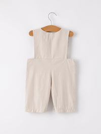 Beige gingham pumpkin-smocked romper for boys on a hanger