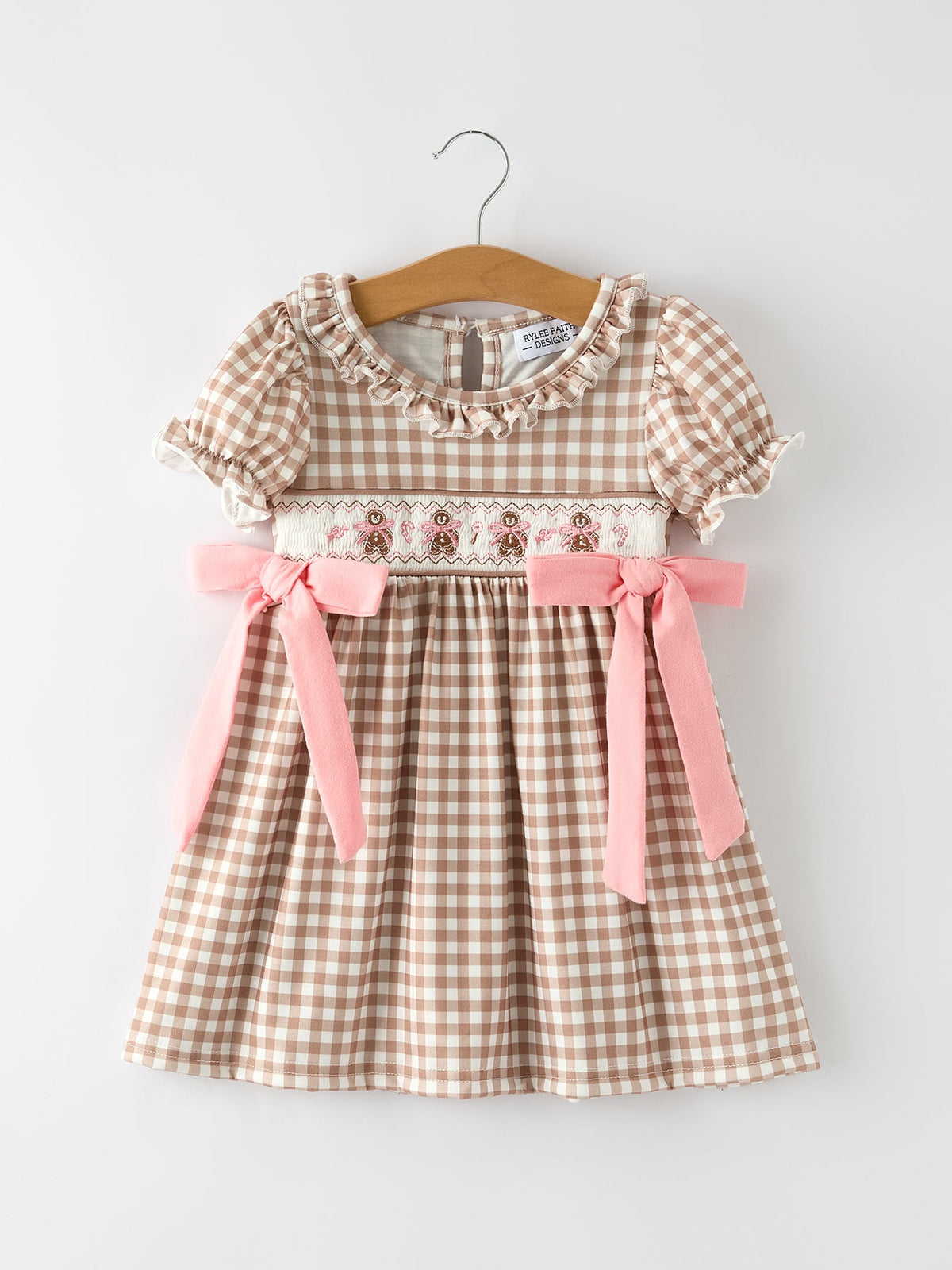Christmas vintage plaid dress with embroidered gingerbread, ruffled neckline, puff sleeves, and pink bows.