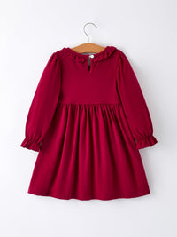 Back of red girls Christmas smocking dress with ruffled collar, long sleeves, and festive embroidery details on hanger.