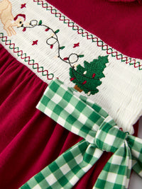 Red girls dress with festive embroidered Christmas tree, reindeer, and lights on white smocking with green plaid bow.