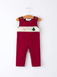 Red baby boys romper featuring Christmas tree dog smocking embroidery, green snap buttons, and leg openings for easy dressing.