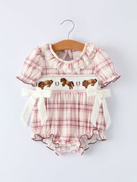 Pink plaid baby girl romper with horse embroidery, smocked bodice, ruffled collar, and white side bows.