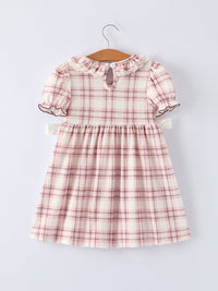 Pink plaid girls dress with ruffled collar, puff sleeves, and keyhole back detail on hanger.