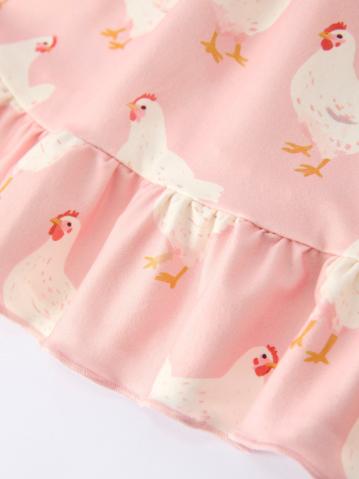 Farm Spring Girls Chicken Print Dress Ruffle In Pink, a must-have dress for girls who adore playful and stylish designs.