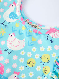 A group of girls wearing the Aqua Spring Chicken Floral Farm Print Dress, capturing a joyful moment during a spring event.