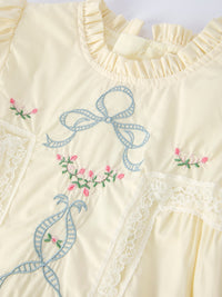 Little girl styling the Embroidered Lace Girls Short Sleeve Dress, perfect for making unforgettable memories at any occasion.